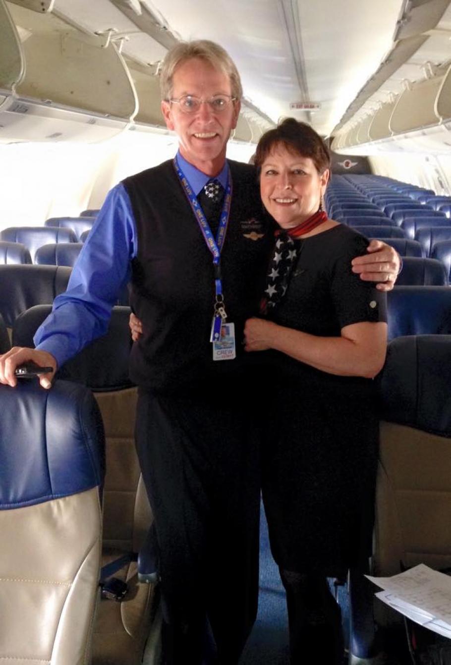 Cindy and George on his first flight as a Southwest Flight attendant.&nbsp;