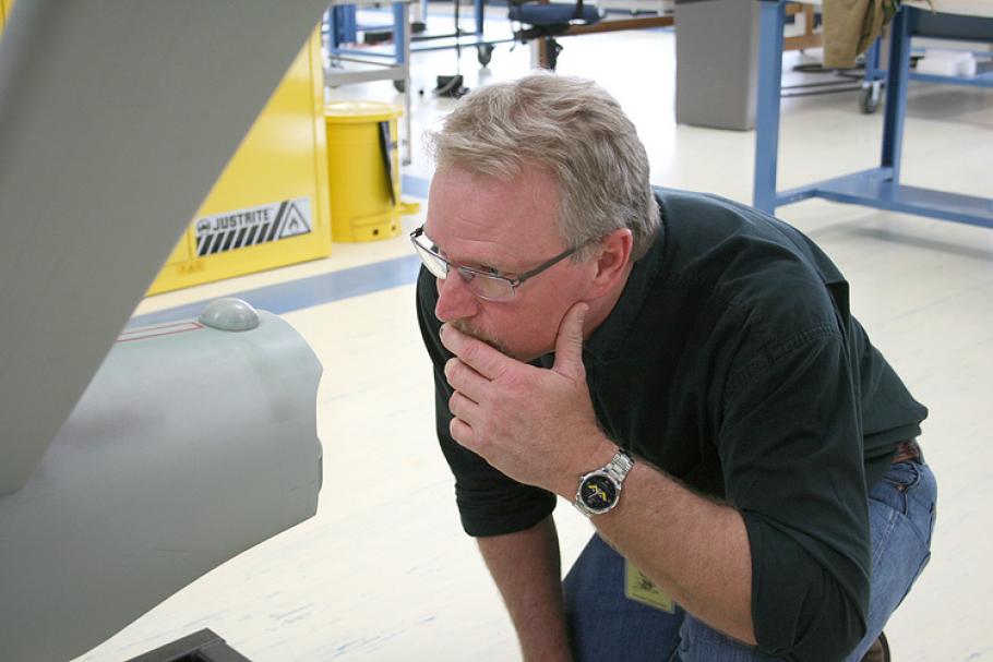 &nbsp;ILM model maker John Goodson studies the hangar deck at the back of the ship’s engineering hull. 